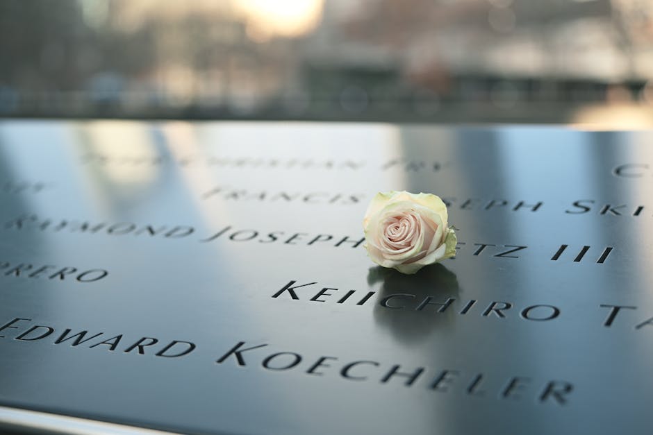 Memorial plaque with white rose representing legacy and value